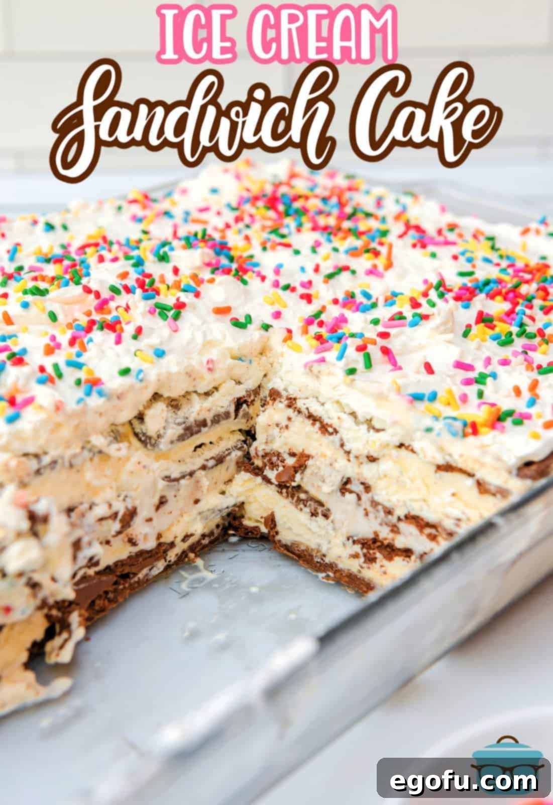 Ice Cream Sandwich Cake Pinterest image in baking pan with slices removed.