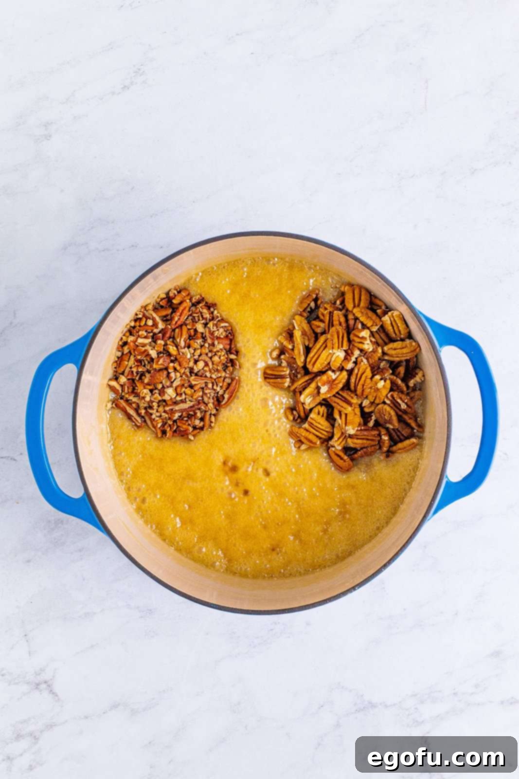 Decadent Southern Pecan Pralines 7 Pecans added to the butter sugar mixture in dutch oven.