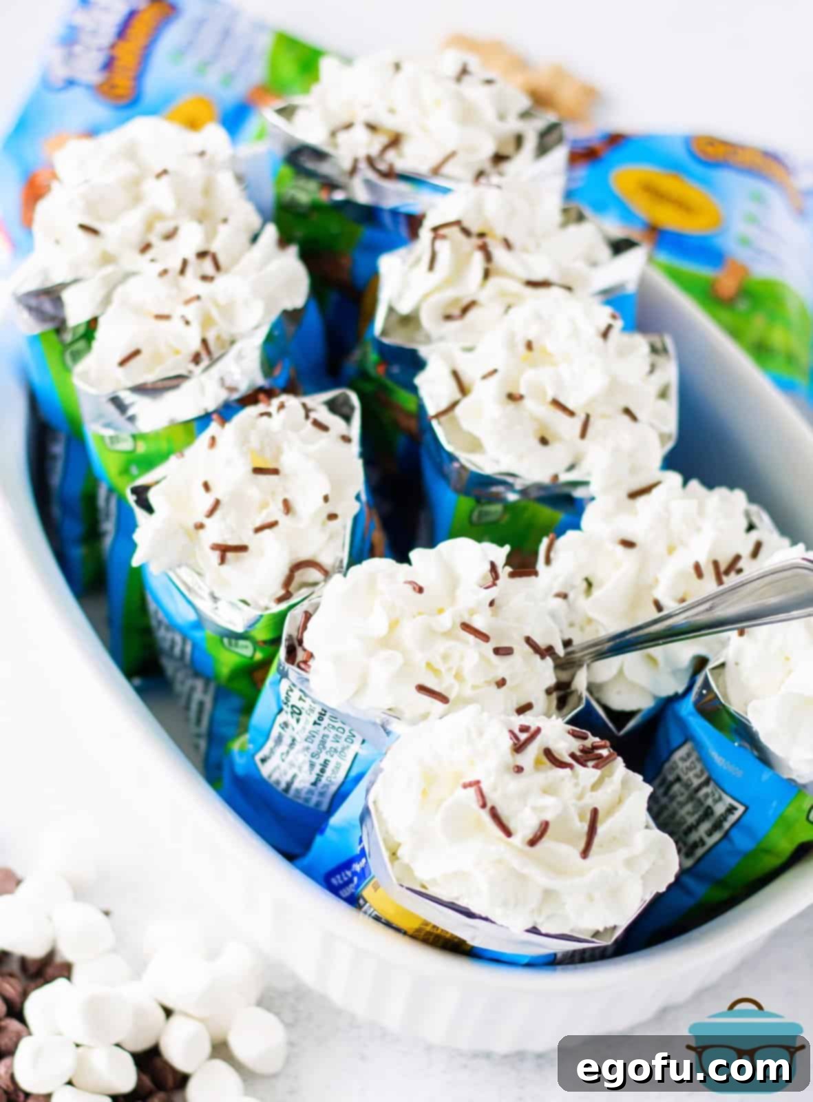 On the Go Smores 6 Overhead of Walking S'mores topped with whipped cream and sprinkles.