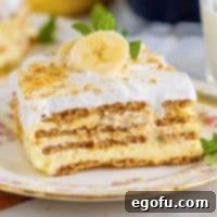 Close-up square image of a slice of Banana Icebox Cake on a plate, showcasing its beautiful layers.