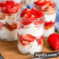 Strawberry Shortcake Jar Delights 15 Close up square image showing layers of Strawberry Shortcake in a jar.