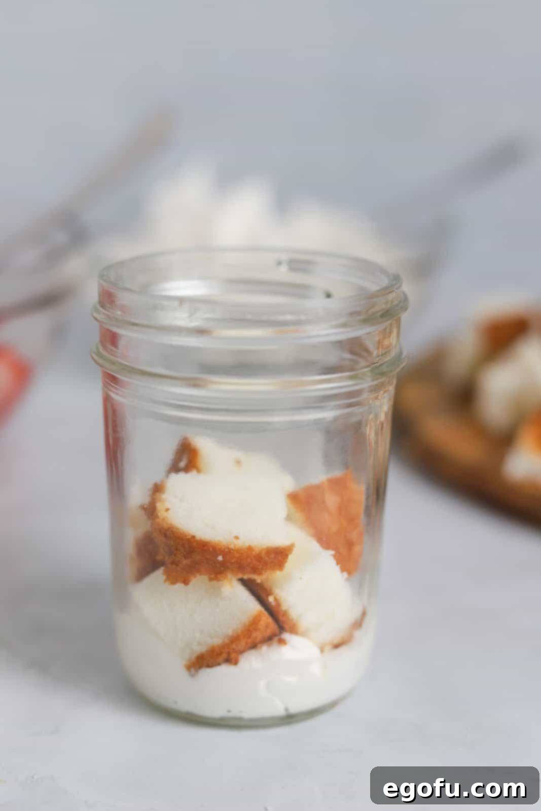 Strawberry Shortcake Jar Delights 9 Some angel food cake added over whipped cream.
