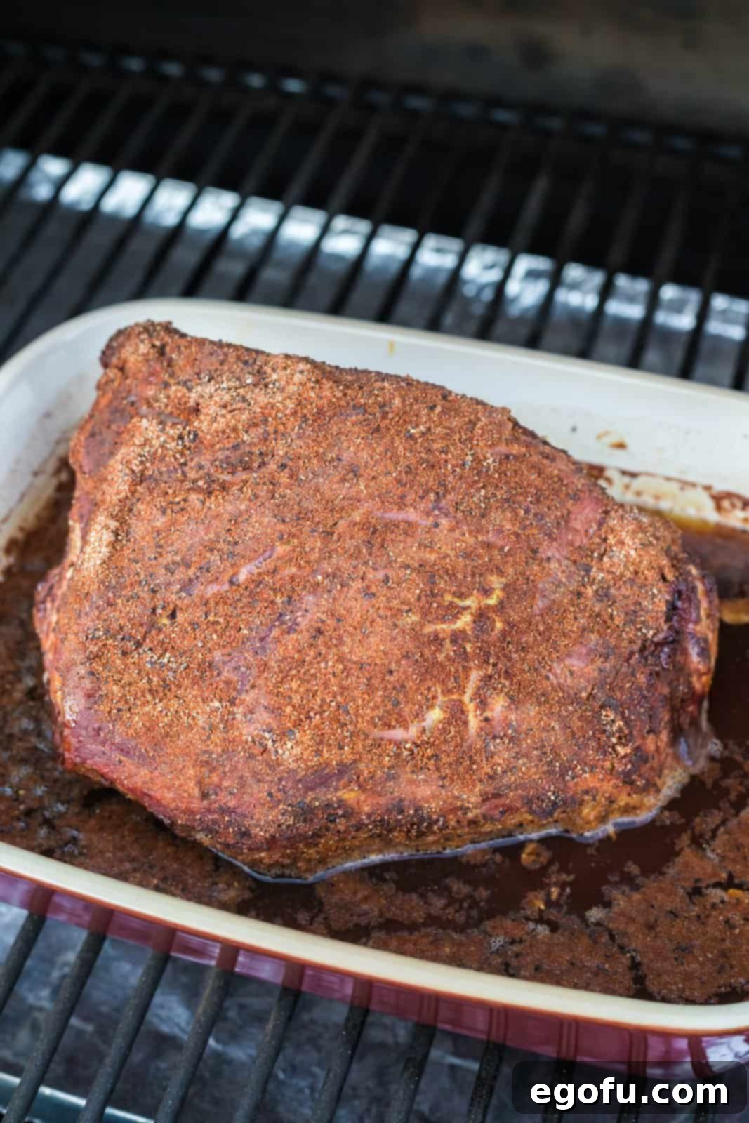 Pitmaster's Smoked Rump 11 The finished, perfectly smoked rump roast resting on a cutting board after being removed from the smoker.