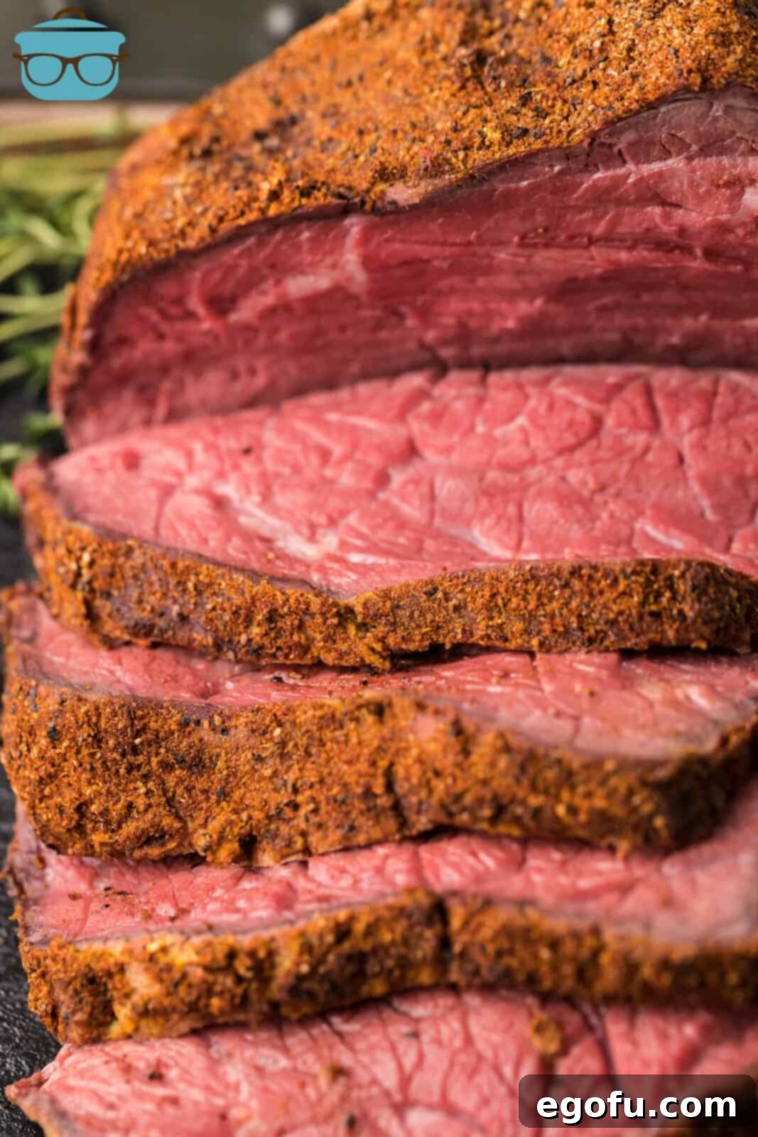 Pitmaster's Smoked Rump 13 An inviting overhead photograph of a perfectly cooked and sliced Smoked Rump Roast arranged on a serving platter.