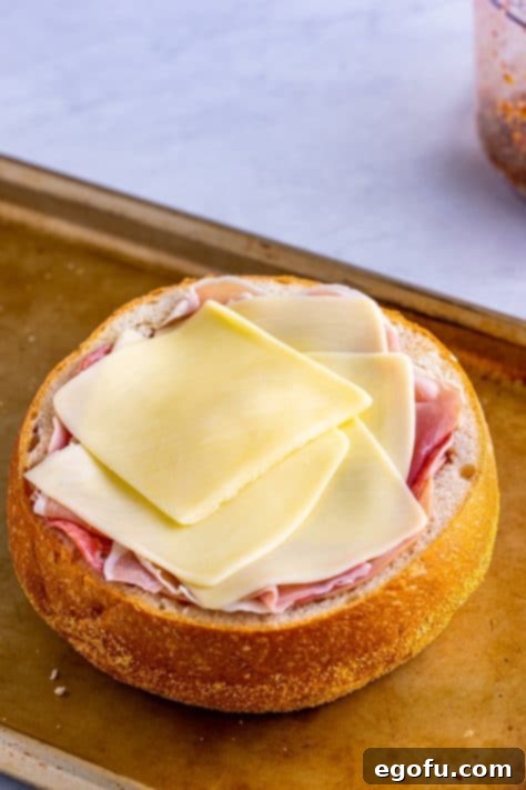 New Orleans' Signature Stack 20 Mozzarella cheese layered over the meat.