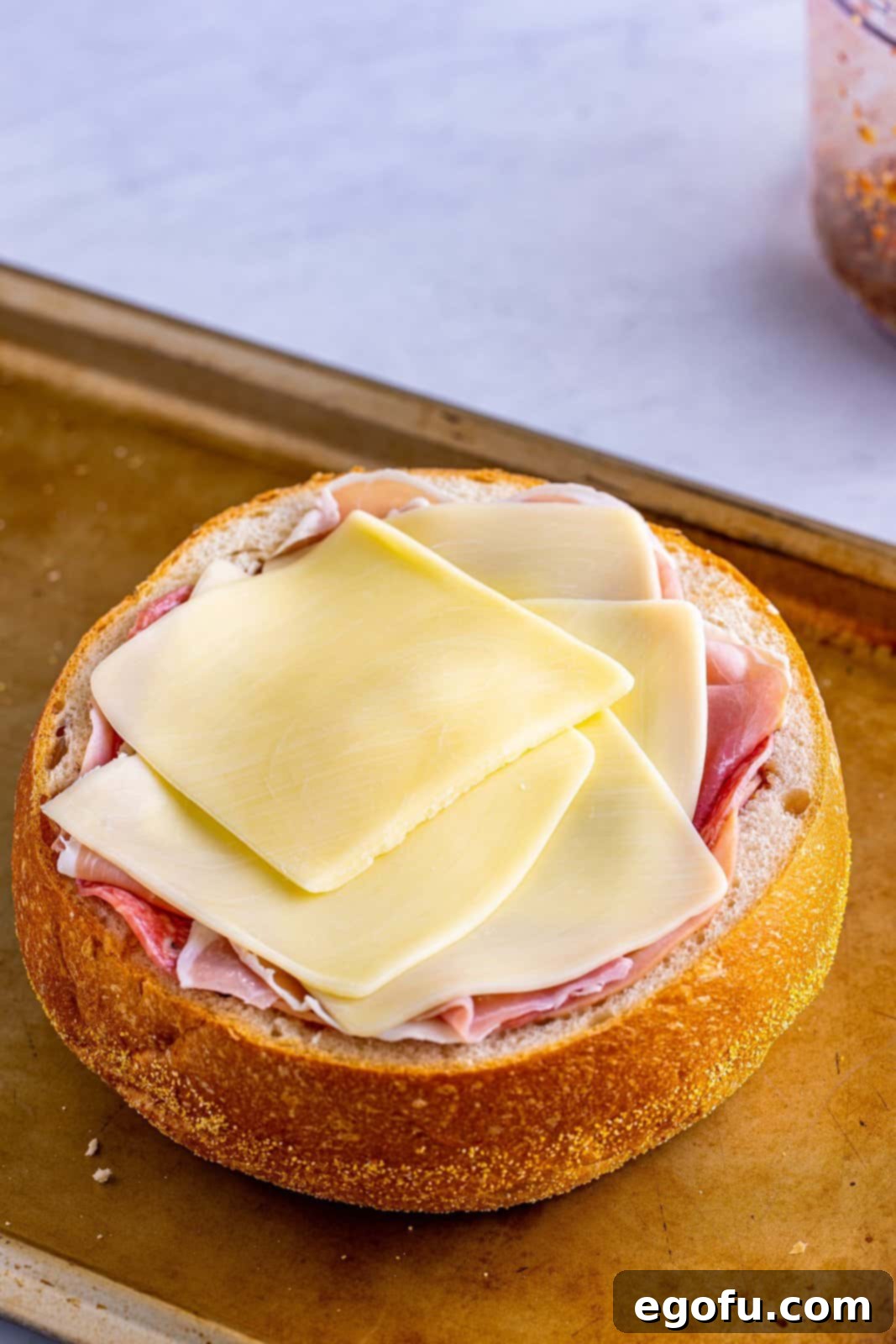 New Orleans' Signature Stack 10 Mozzarella cheese layered over the meat.