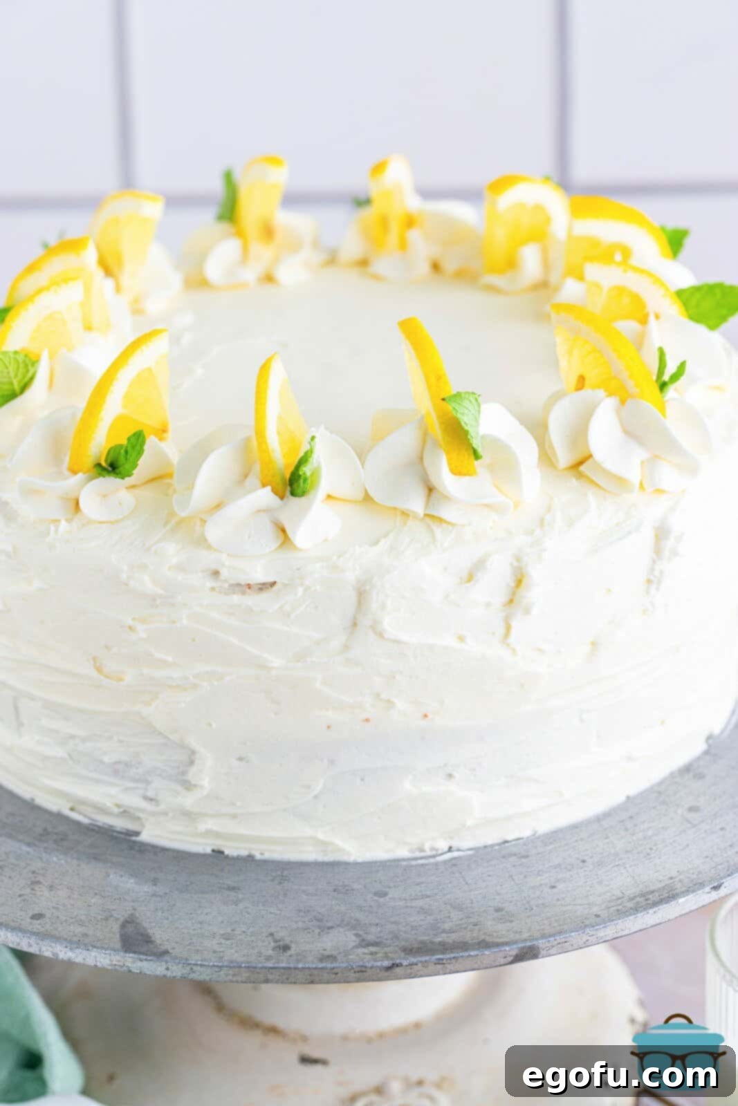 Zesty Lemon Dream Cake 19 Finished Lemon Layer Cake decorated on cake stand.