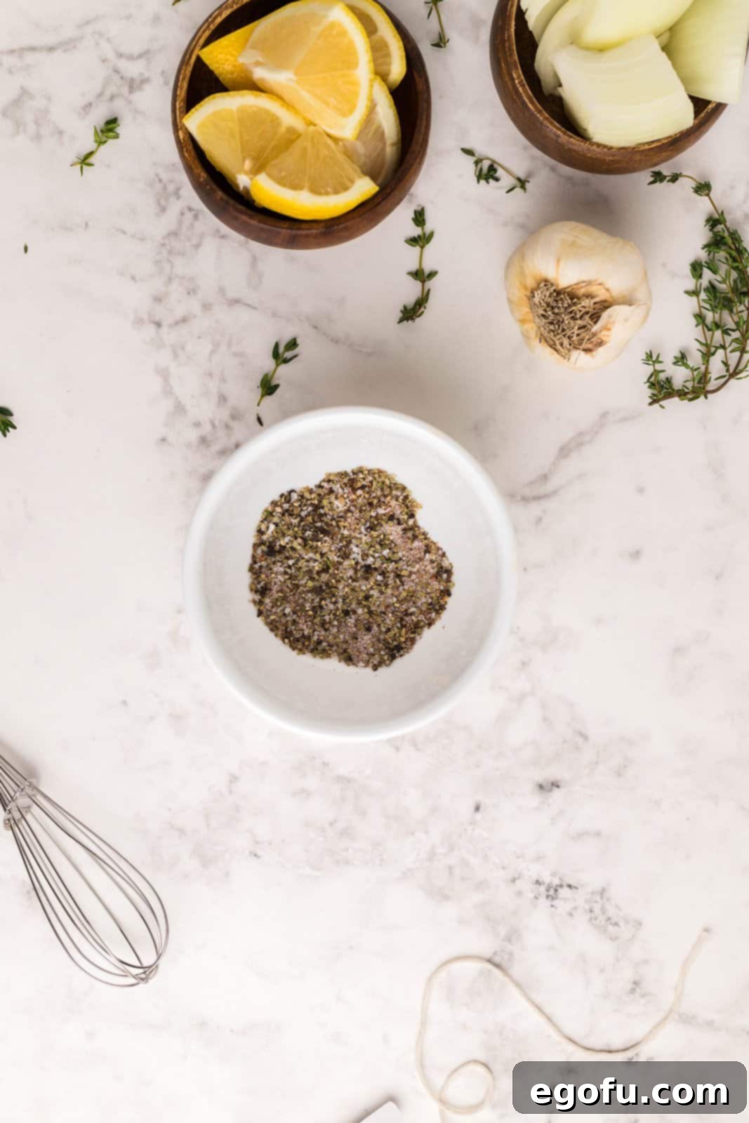 Various seasonings mixed together in a small bowl, ready to be applied to the chicken.