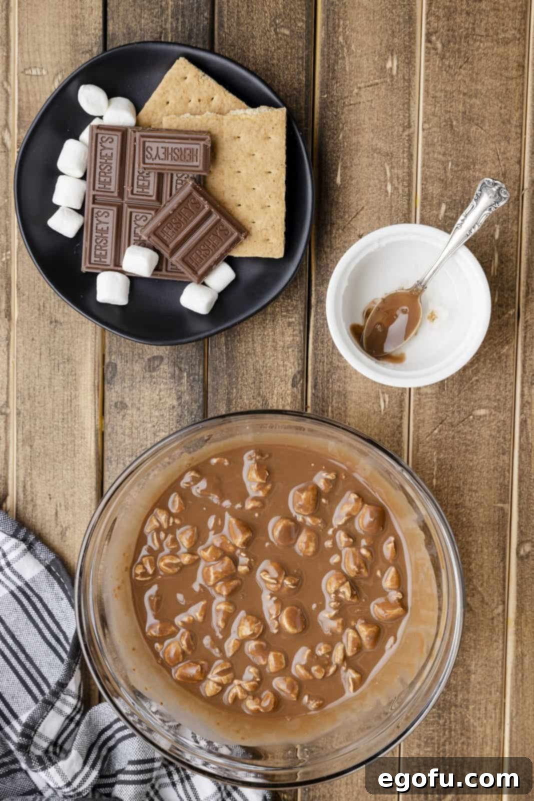 Smores Snap Shell 8 Graham cracker pieces and marshmallows stirred into bowl of chocolte.