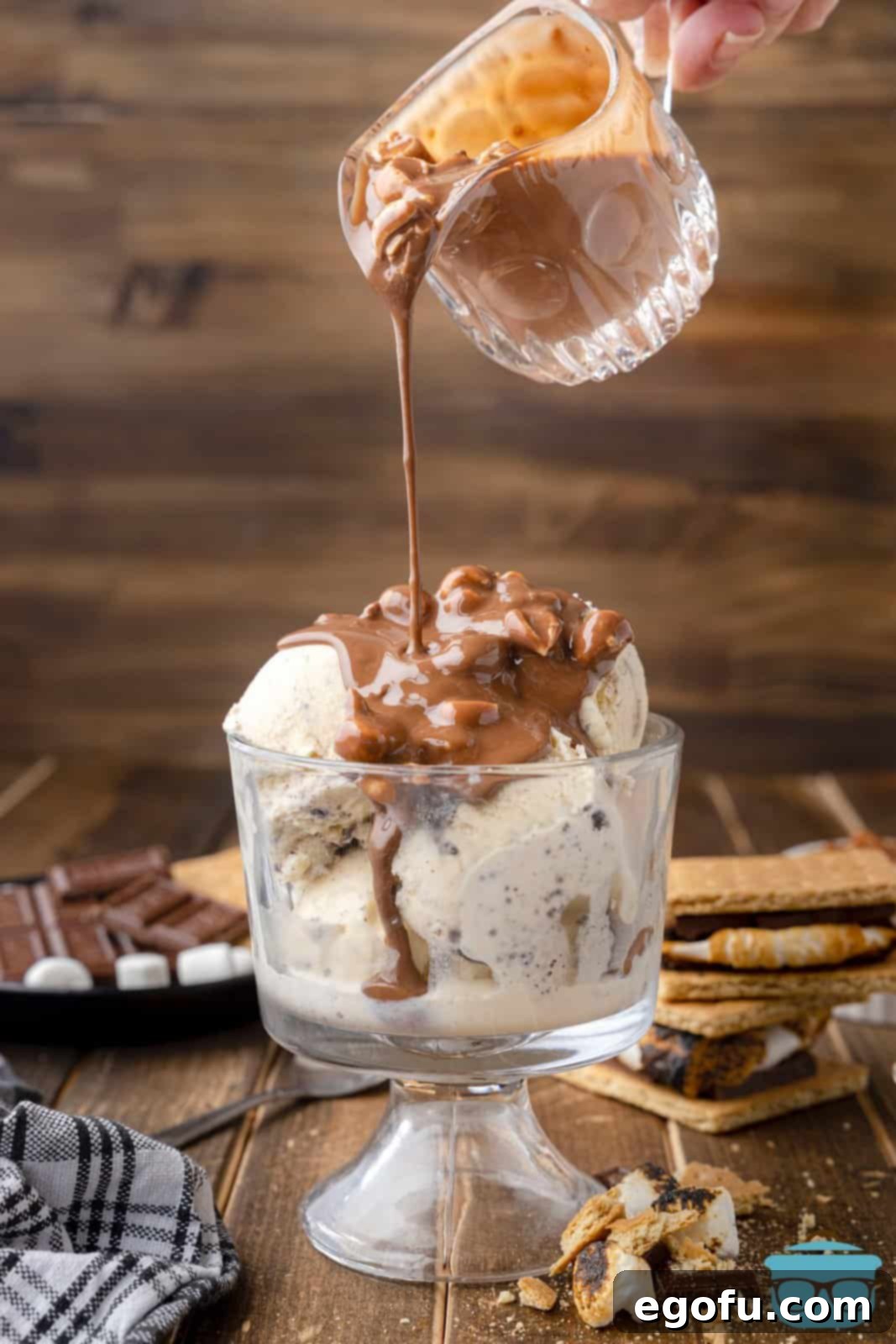 Smores Snap Shell 9 S'mores Magic Shell being poured over ice cream in dish.