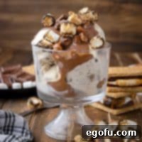 Smores Snap Shell 10 Square image of S'mores Magic Shell over ice cream in glass parfait dish.