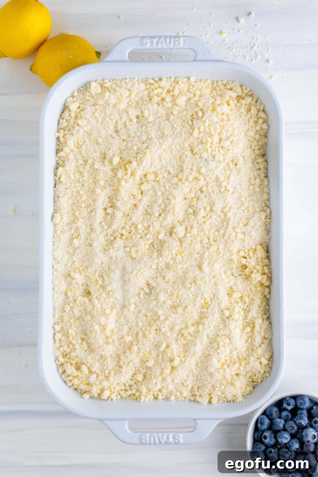 Remaining crumble mixture sprinkled over cake batter.