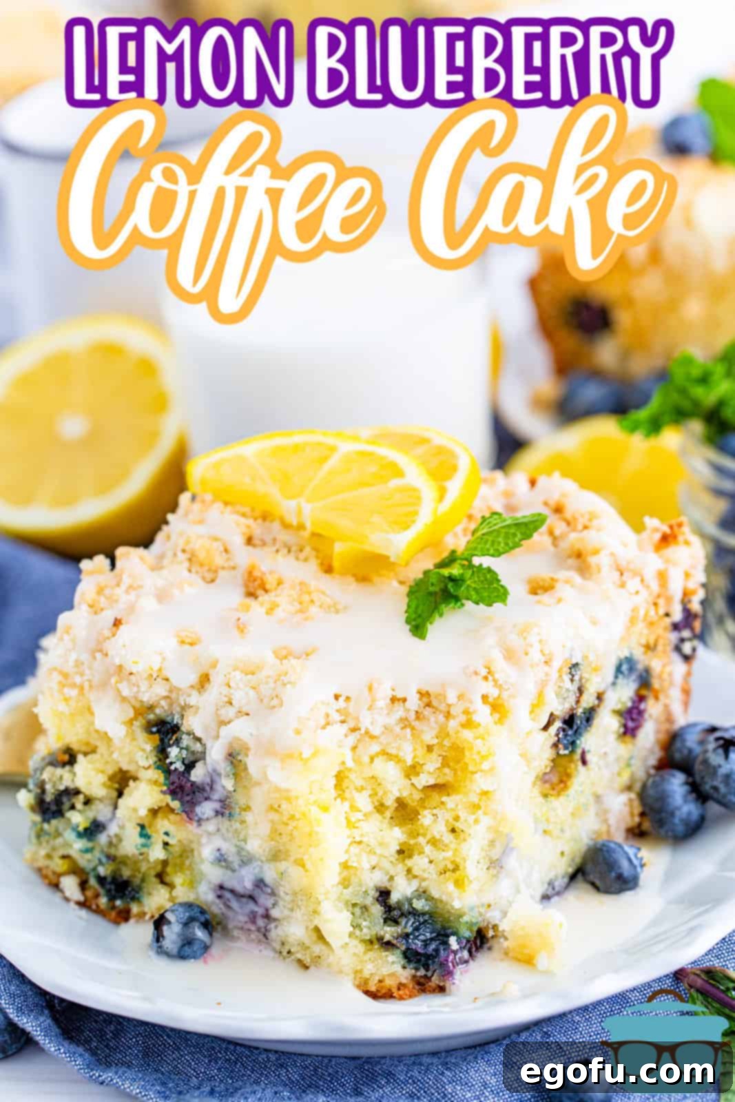 Pinterest image of slice of Lemon Blueberry Coffee Cake on plate with bite taken out.