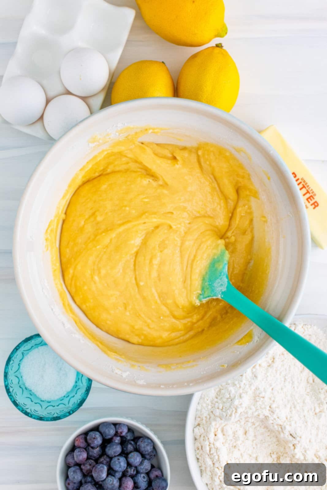 Wet and dry ingredients mixed together in bowl.