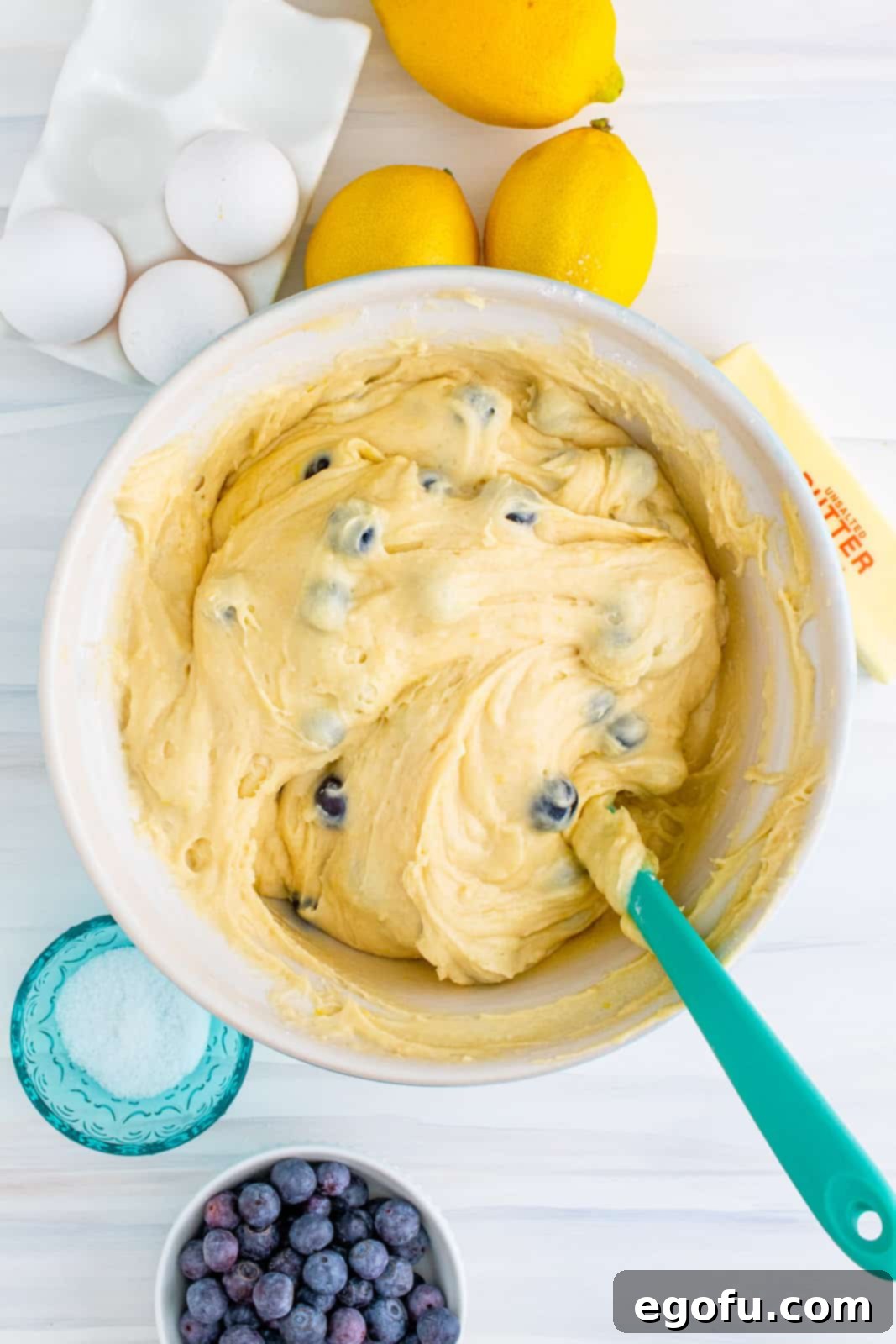 Blueberries folded into cake batter.