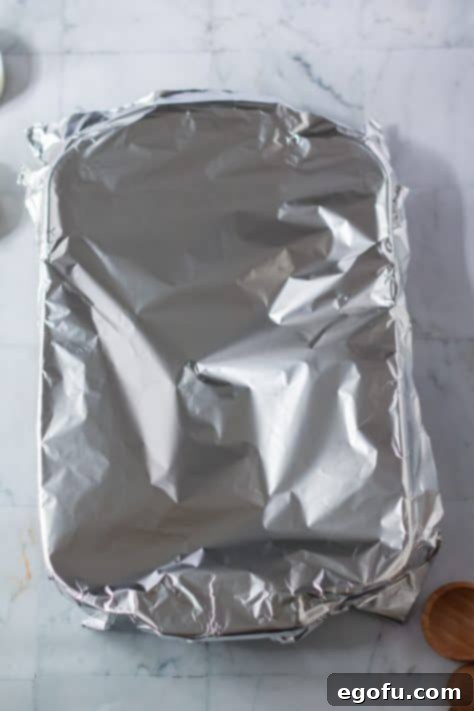Pan covered with foil ready to be baked.