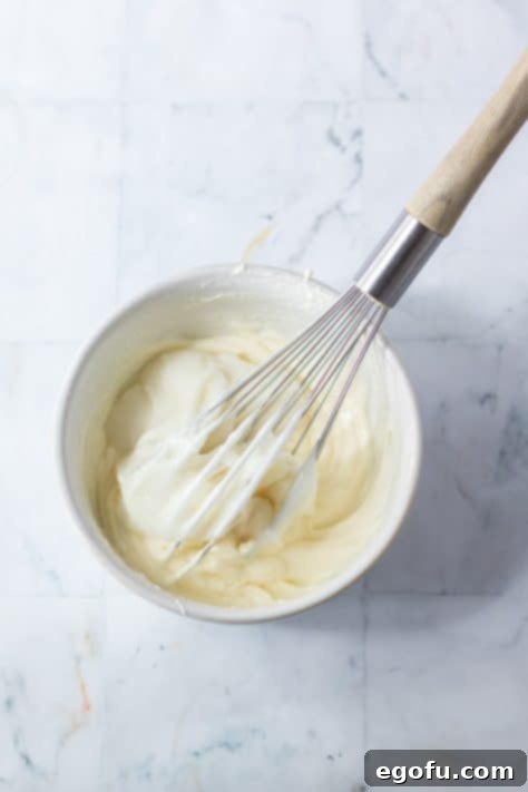 Icing ingredients mixed together in bowl.