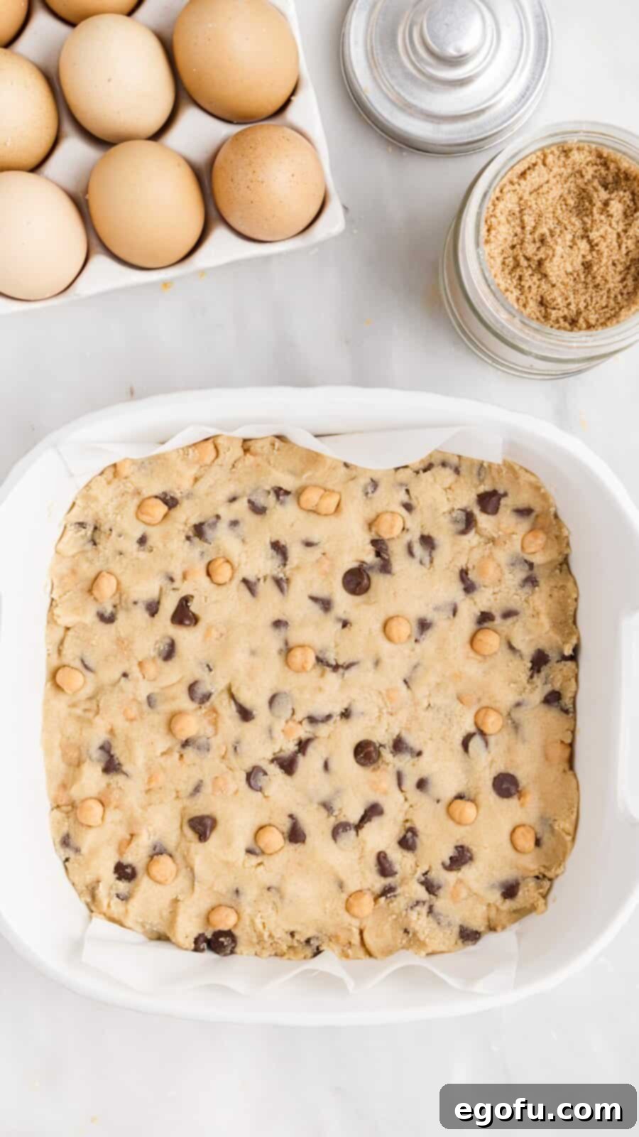 Sweet and Salty Caramel Chocolate Chip Bars 11 Dough pressed into prepared baking pan.