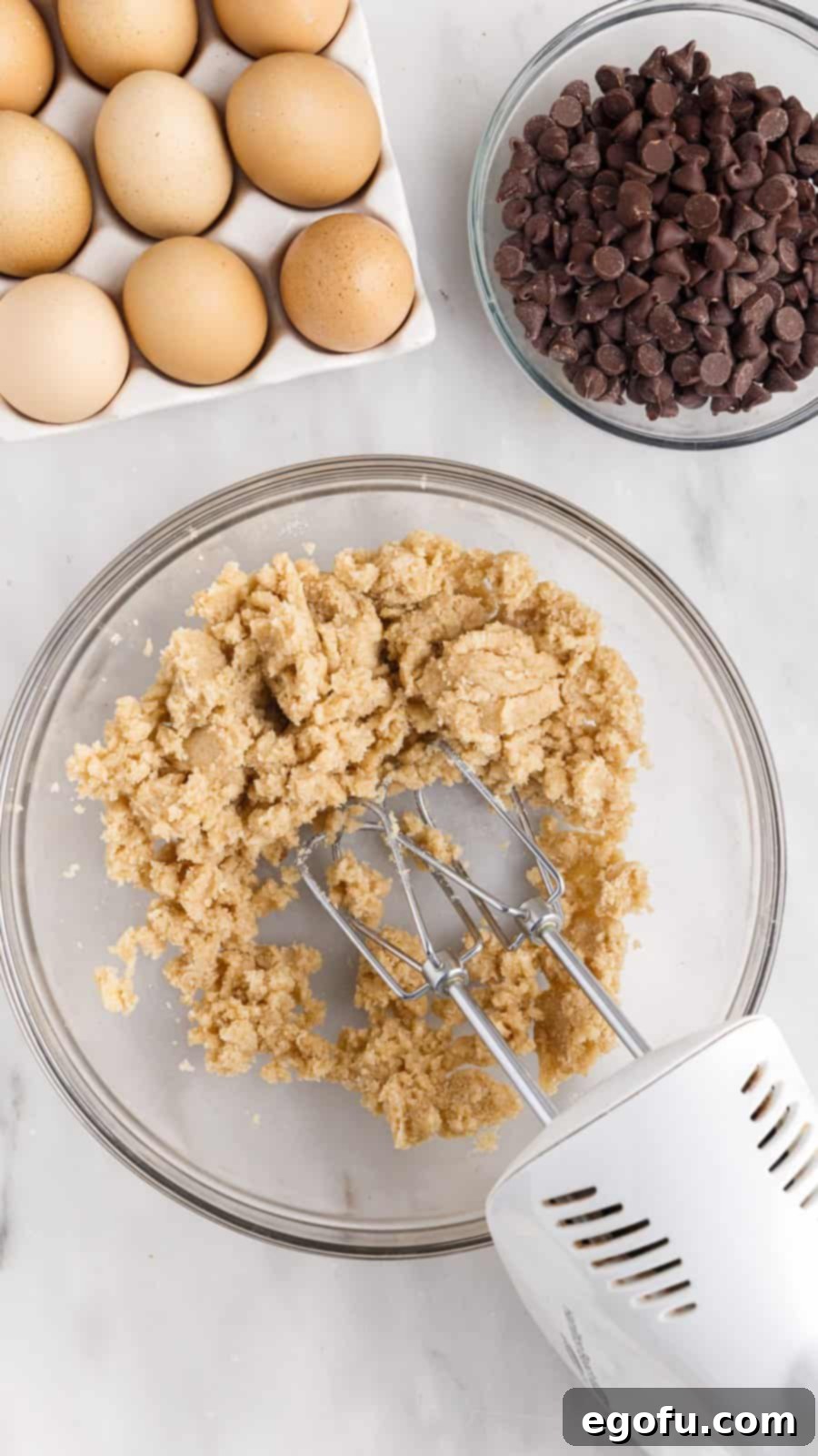 Sweet and Salty Caramel Chocolate Chip Bars 6 Sugars and butter beaten together in bowl.