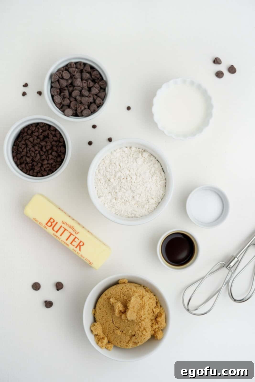 Choc-Chip Dough Delight 4 All ingredients laid out: unsalted butter, light brown sugar, vanilla extract, salt, heat-treated all-purpose flour, semi-sweet chocolate chips, and mini semi-sweet chocolate chips.
