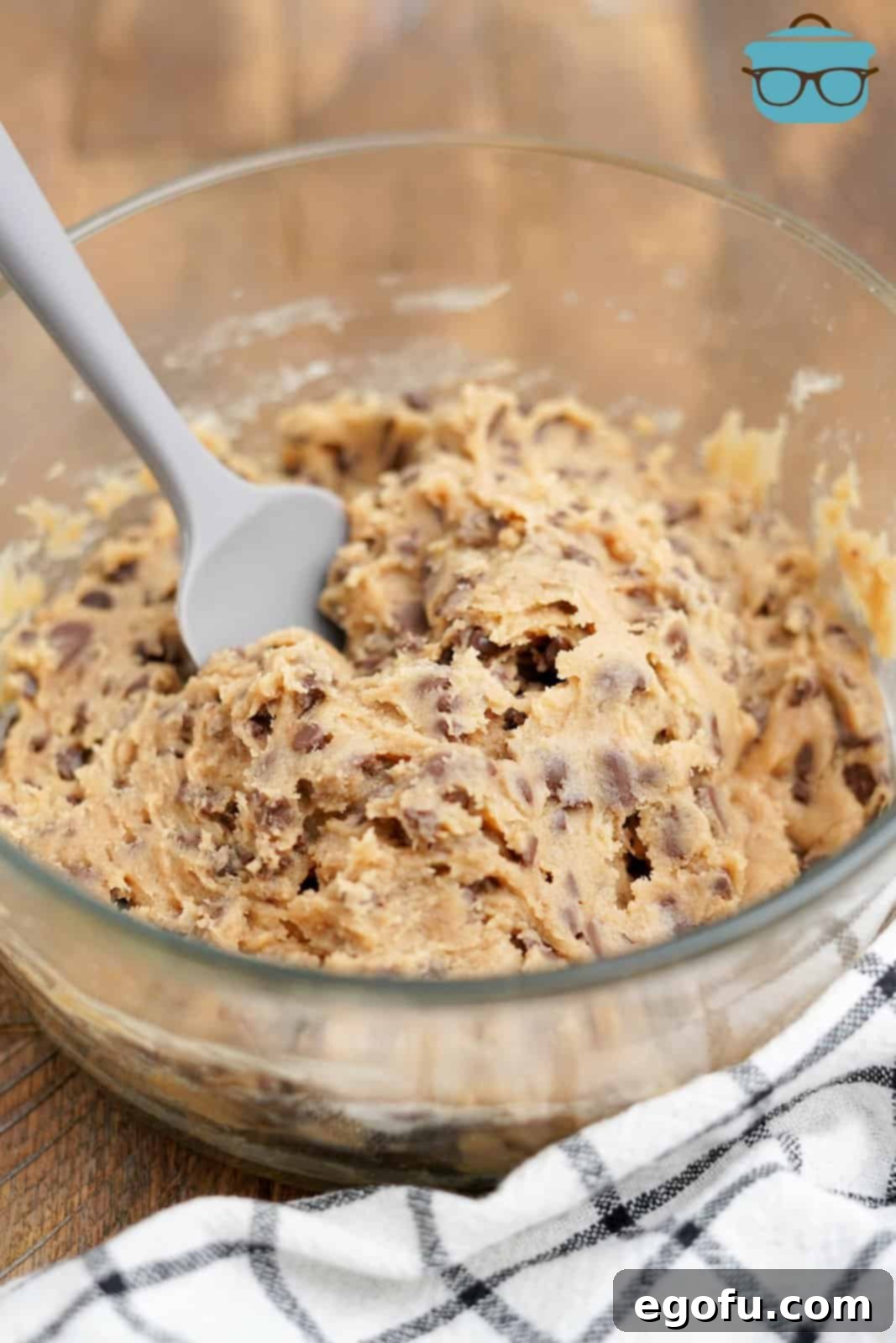Choc-Chip Dough Delight 9 A large bowl of finished Edible Chocolate Chip Cookie Dough with a spatula in it, tempting to eat.