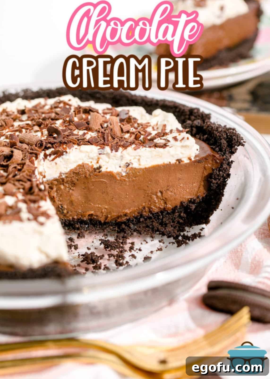 Pinterest image of finished Chocolate Cream Pie with slices removed, showcasing its creamy filling and dark crust.