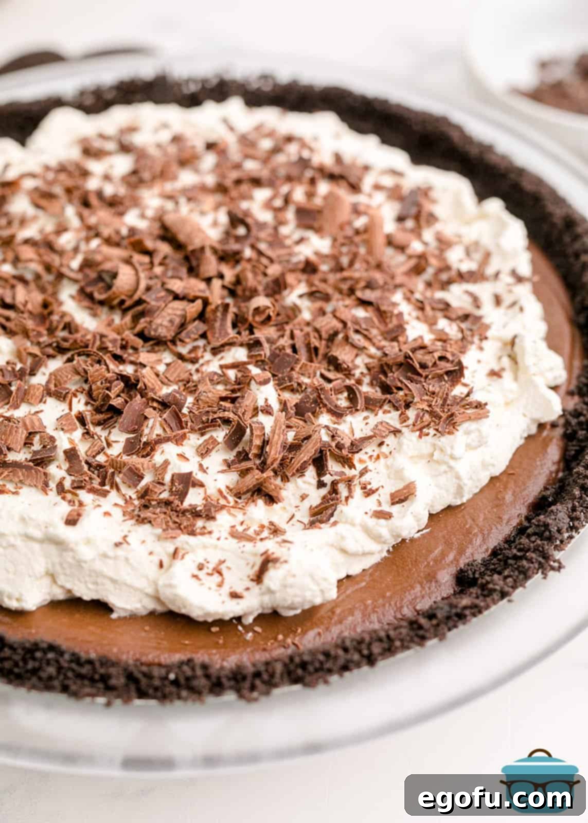 A finished Chocolate Cream Pie, beautifully topped with chocolate shavings, ready to be sliced.