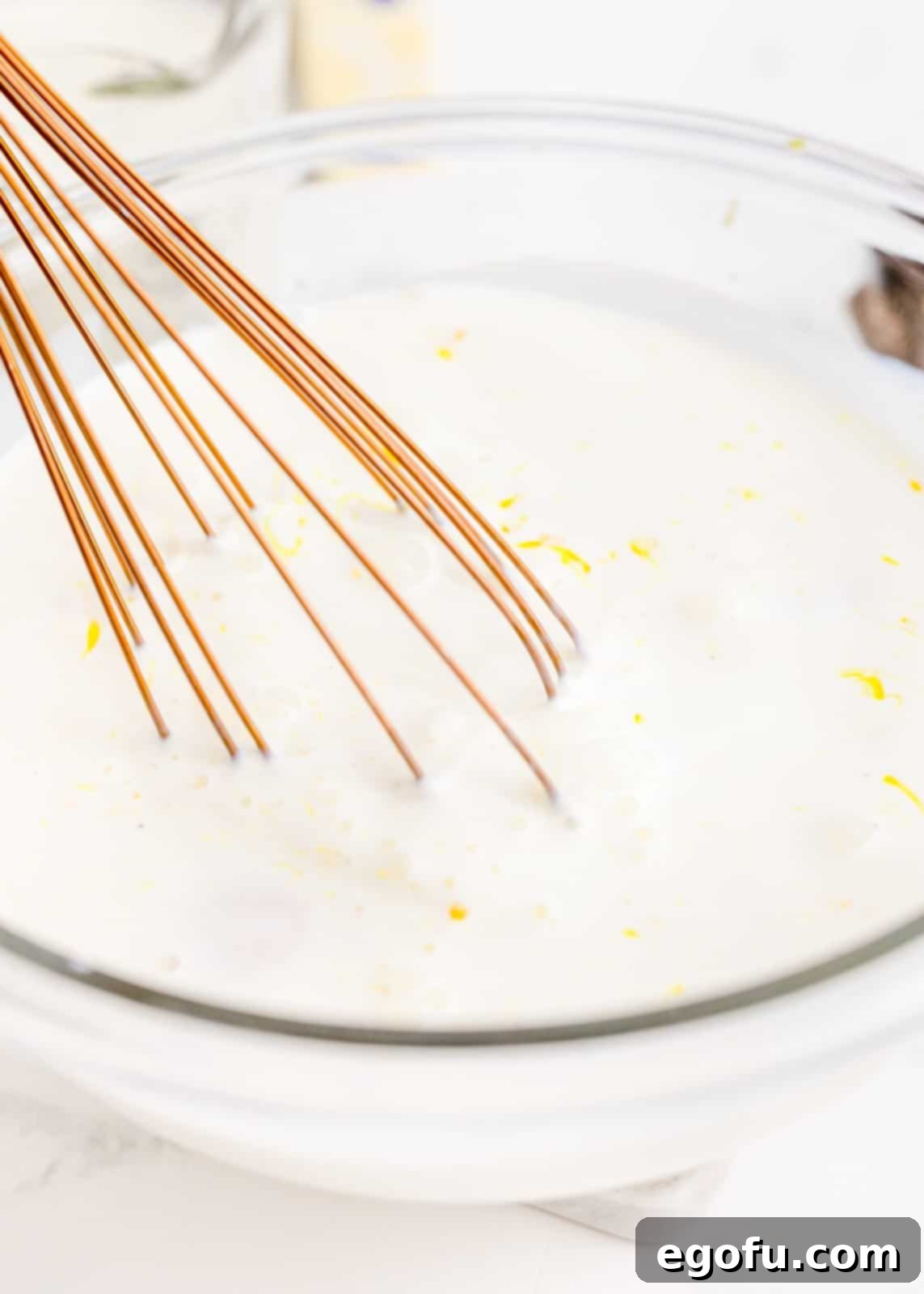 Half and half and egg yolks whisked together in a separate bowl until smooth.