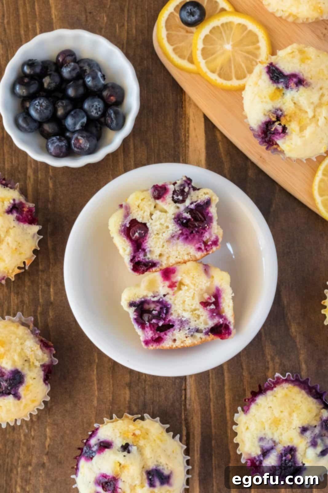 Overhead photo of one Lemon Blueberry Muffin cut in half showing the inside.