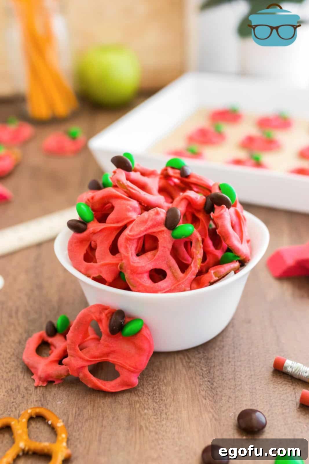Back-to-School Chocolate Covered Pretzels in white bowl with ingredients surrounding it.