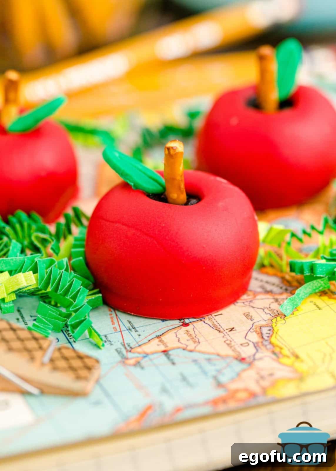 Back-to-School Apple Shaped Oreo Truffles on a map background, showcasing their festive appearance for the start of the school year, perfect for gifting.