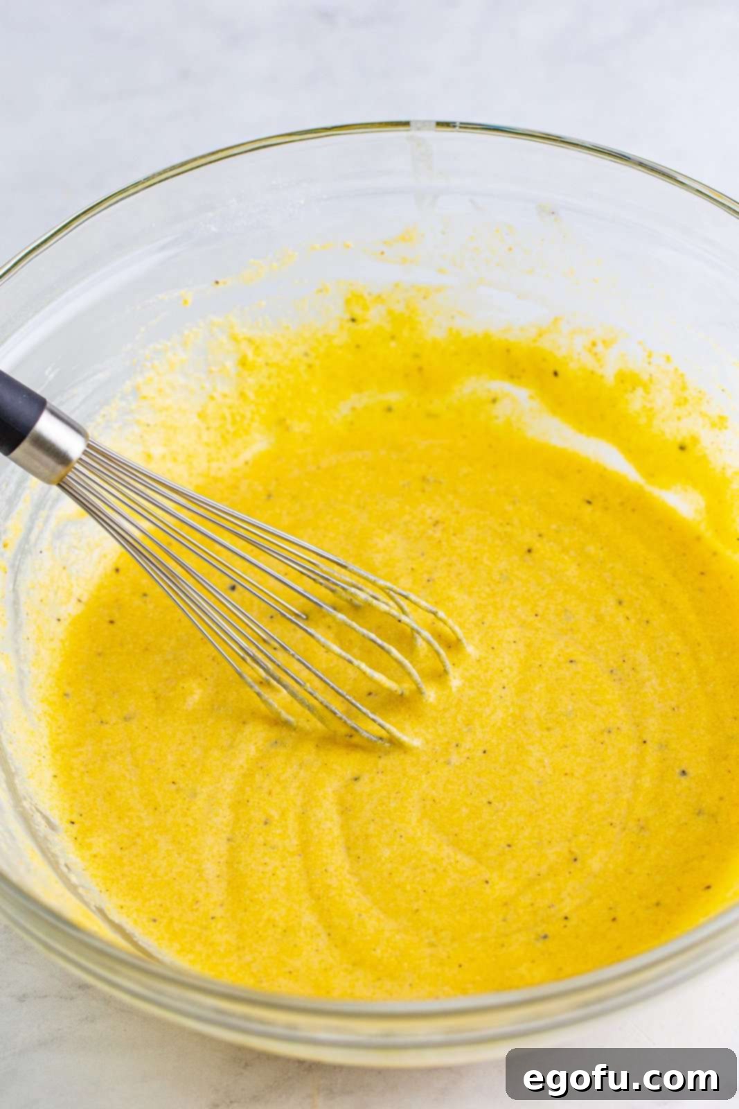 Wet ingredients whisked into dry ingredients.