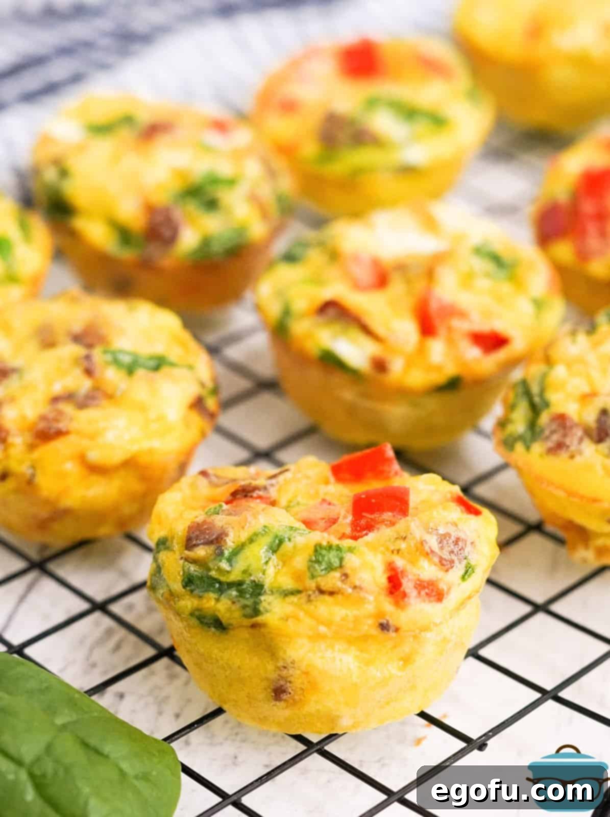 Finished Breakfast Egg Muffins on wire rack cooling.