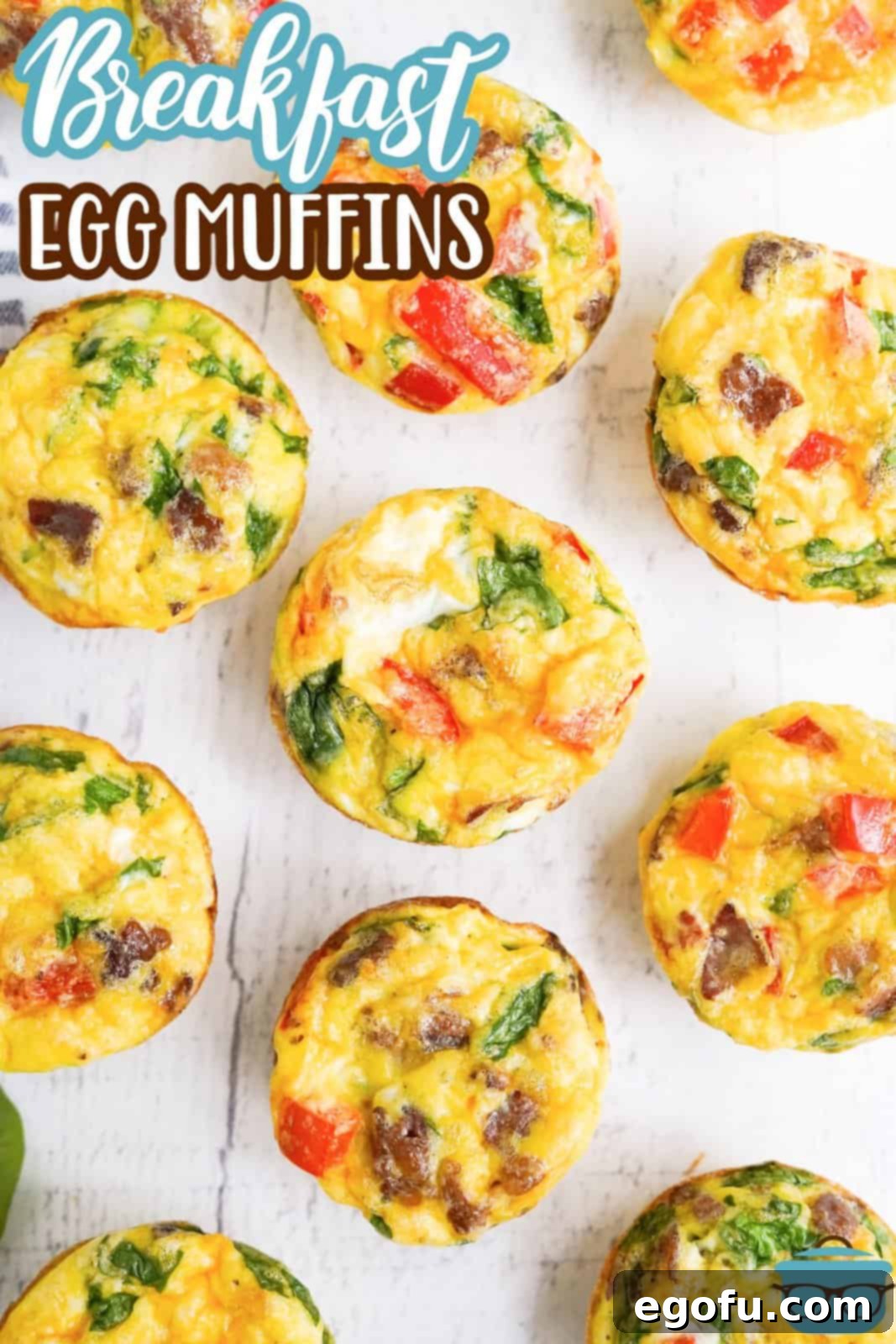 Pinterest image of Breakfast Egg Muffins on white board overhead.
