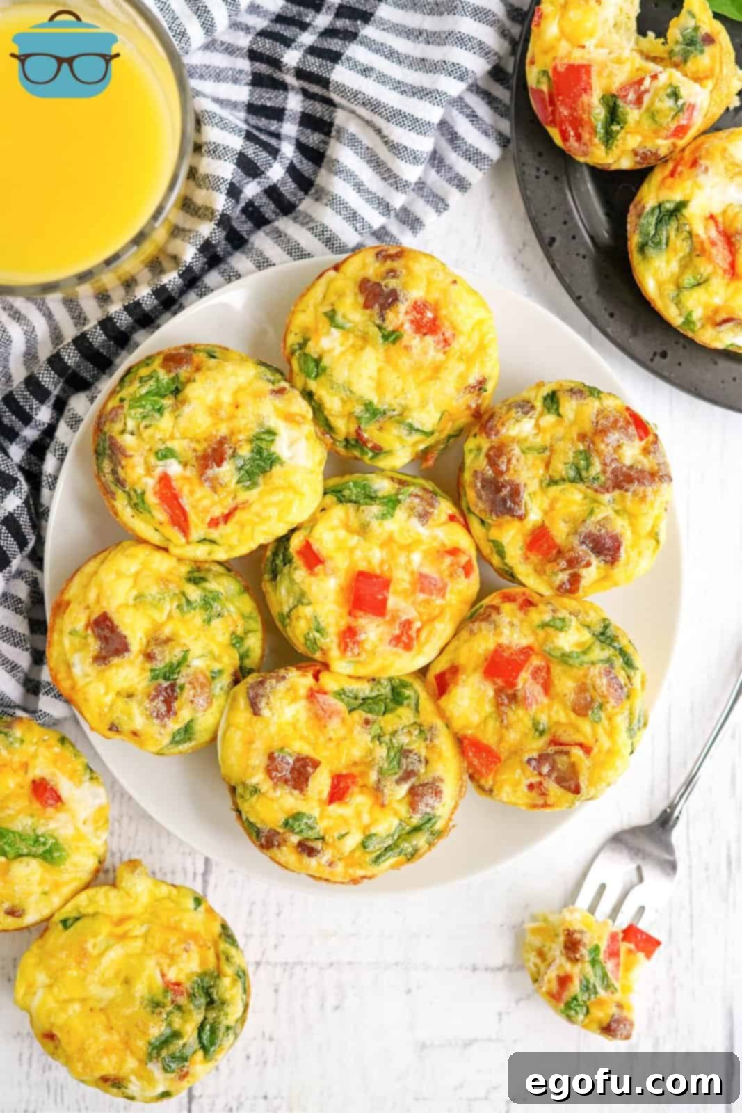 Overhead of white plate with Breakfast Egg Muffins.
