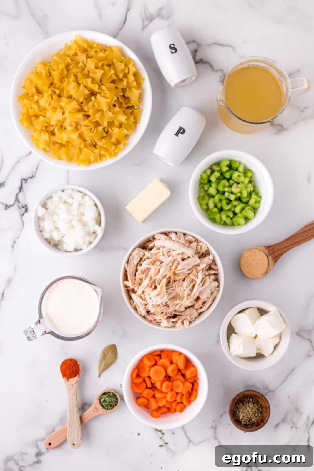 Ingredients needed: shredded chicken, carrots, celery, white onion, butter,  chicken broth, bay leaf, garlic powder, parsley, Italian seasoning, salt, pepper, smoked paprika, cream cheese, heavy cream and pasta.