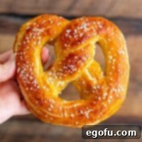 Close-up square image of one of the Homemade Soft Pretzels, beautifully golden and salted.