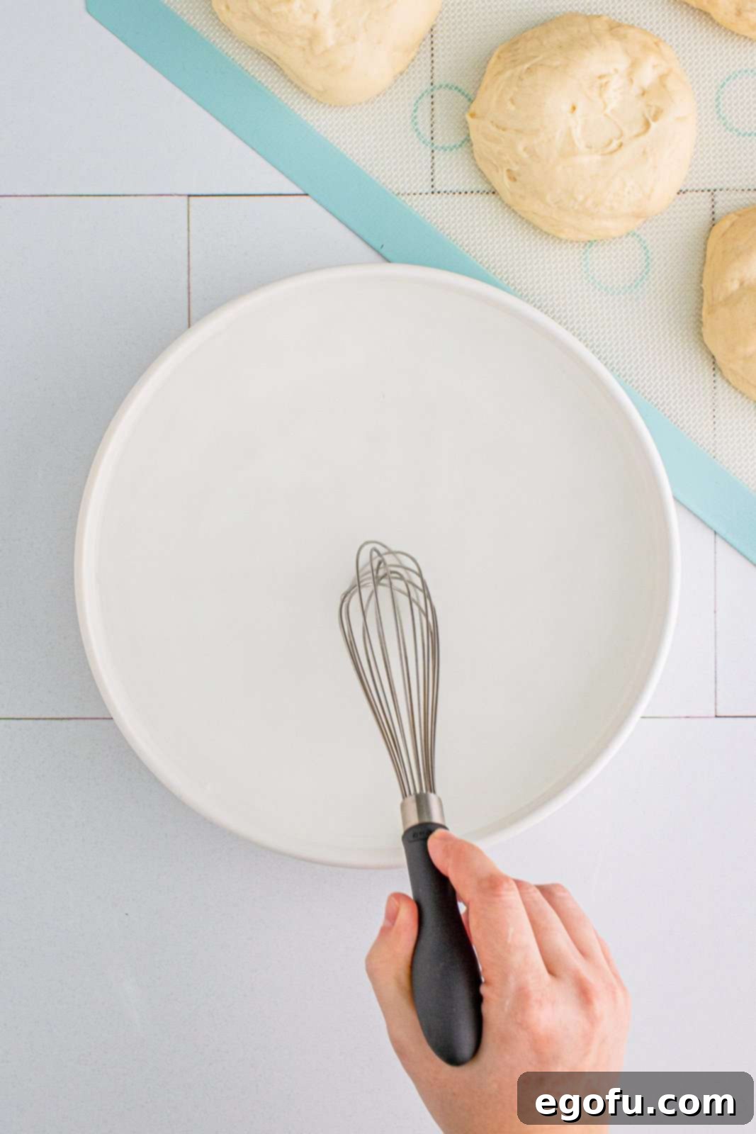 Baking soda and hot water mixture, whisked in a shallow bowl.