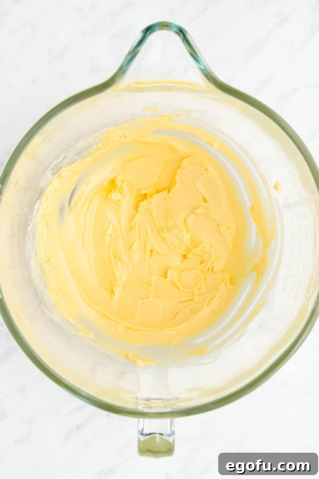 Butter beaten in bowl.