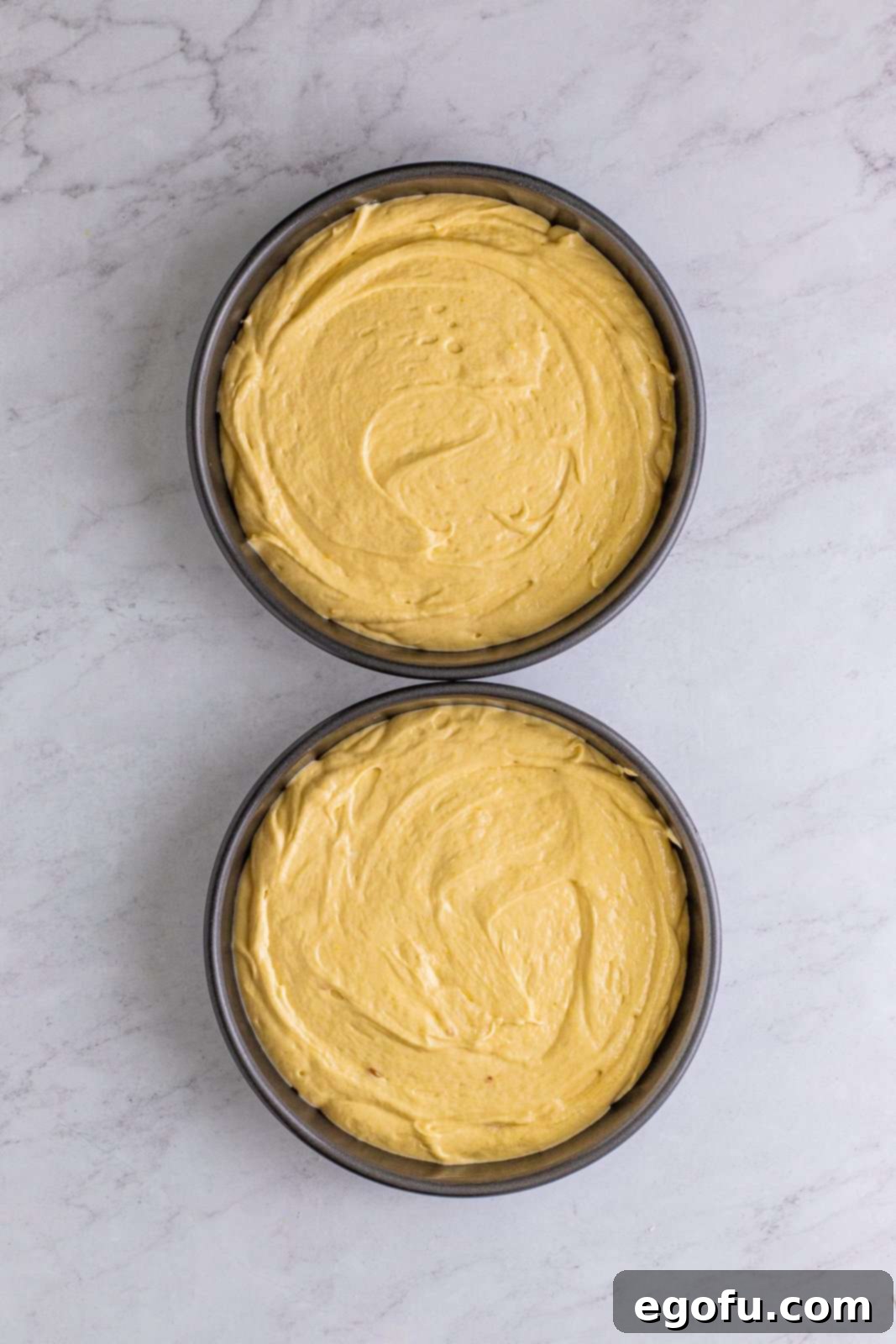Golden Southern Caramel Delight 13 Cake batter added to two prepared pans.