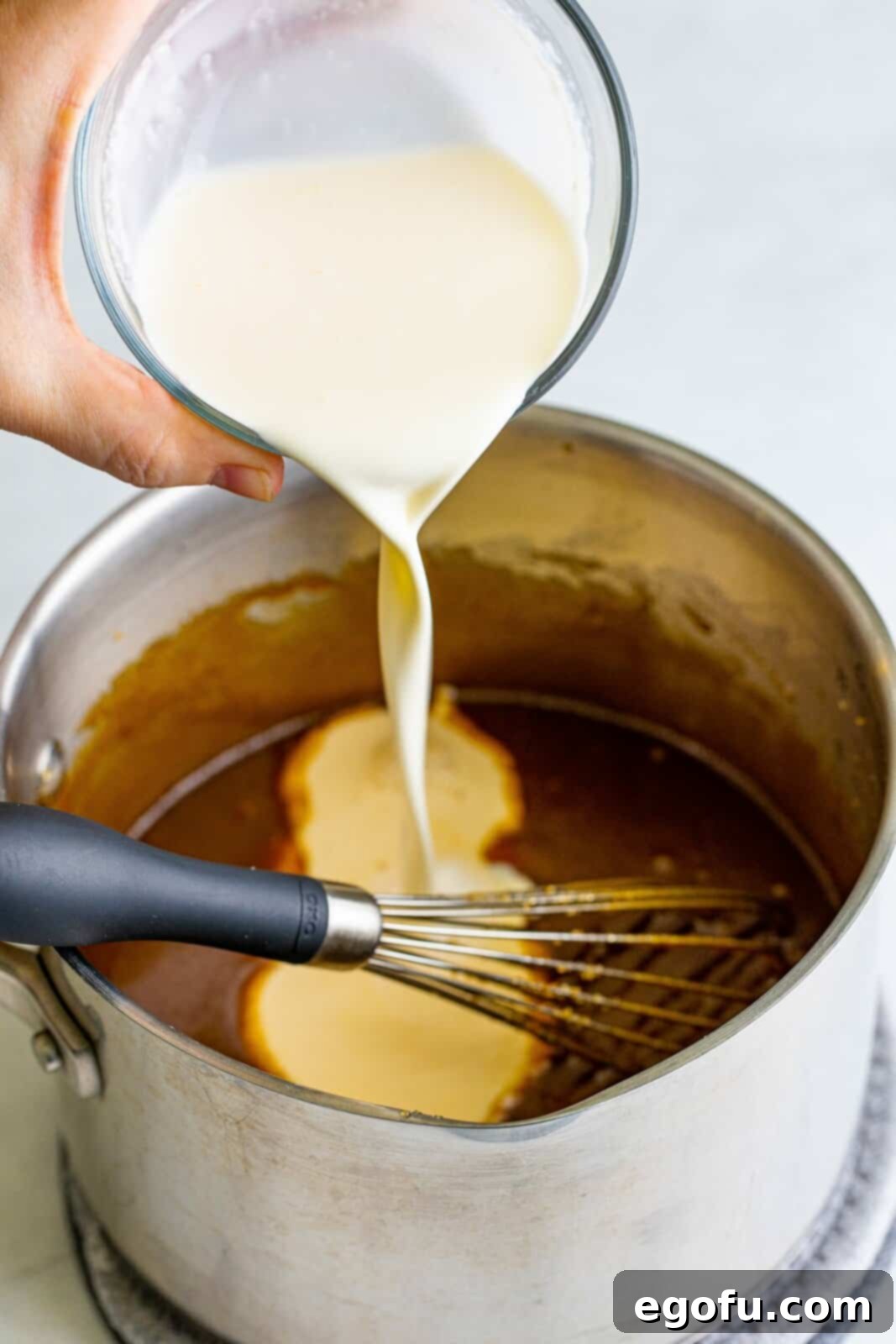 Golden Southern Caramel Delight 16 Evaporated milk and heavy cream added to melted brown sugar butter mixture.