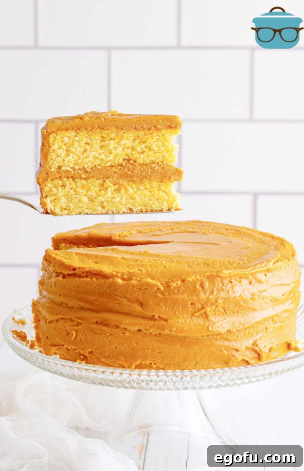 Golden Southern Caramel Delight 21 Cake server holding up a slice of Southern Caramel Cake.