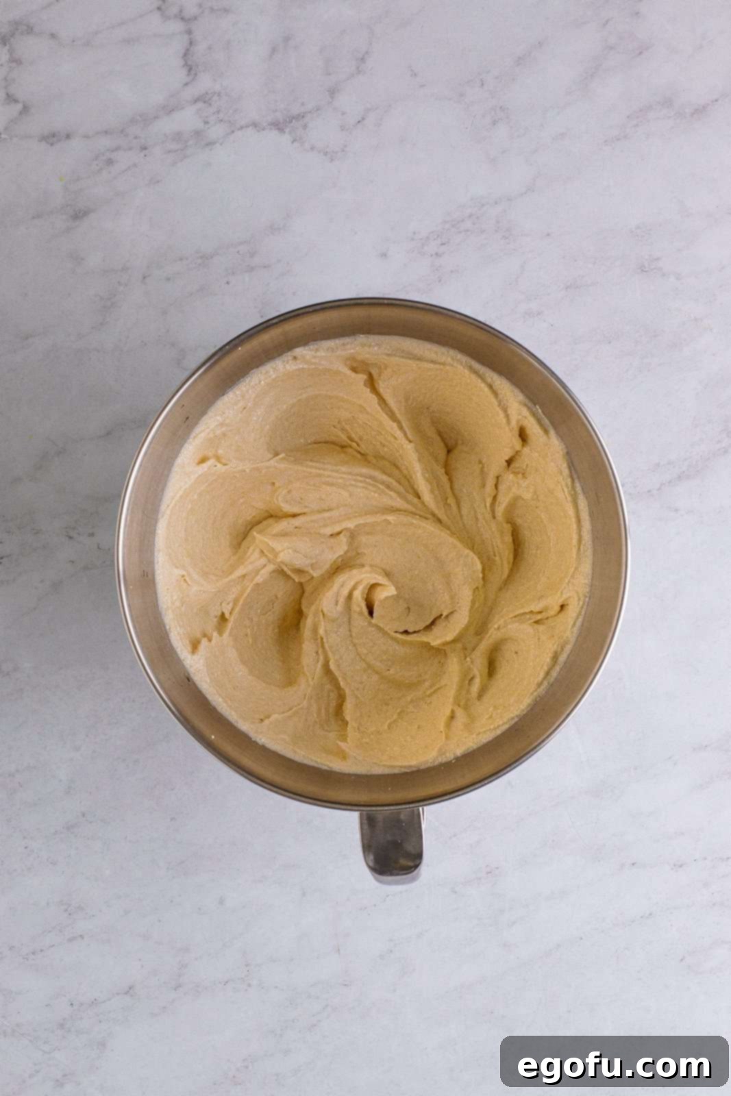 Golden Southern Caramel Delight 8 Sugar beaten into oil and butter in bowl of stand mixer.