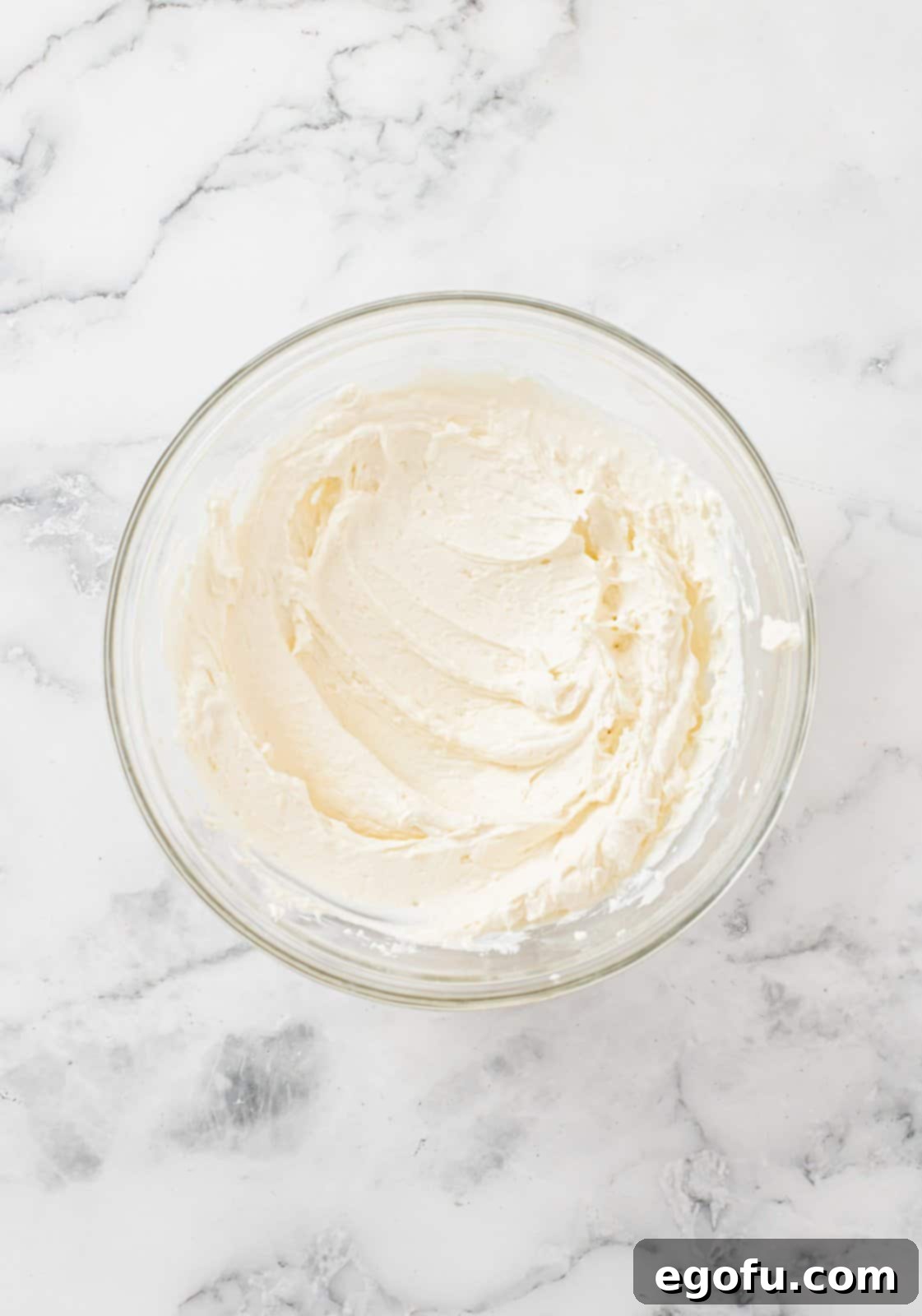 Cream cheese frosting in bowl.