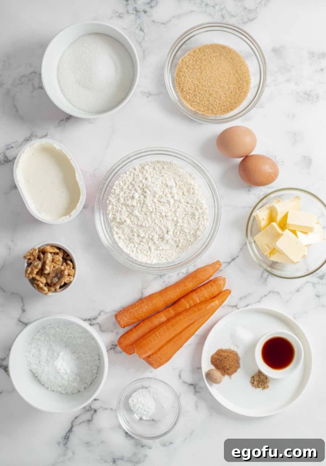 Ingredients needed: eggs, butter, granulated sugar, brown sugar, vanilla extract, all-purpose flour, grated carrots, ground cinnamon, nutmeg, walnuts, ground ginger, baking powder, baking soda, salt, cream cheese and powdered sugar.