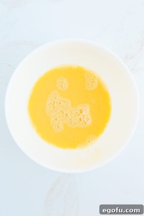 Egg wash mixed together in bowl.