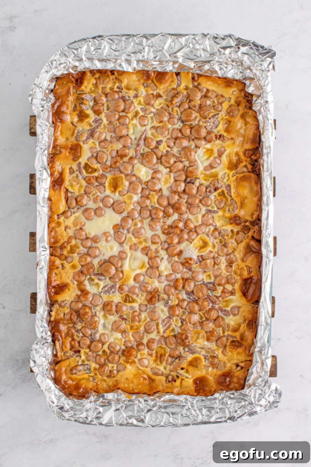 The finished Turtle Magic Bars, baked to golden perfection and cooled in the pan, ready to be sliced.