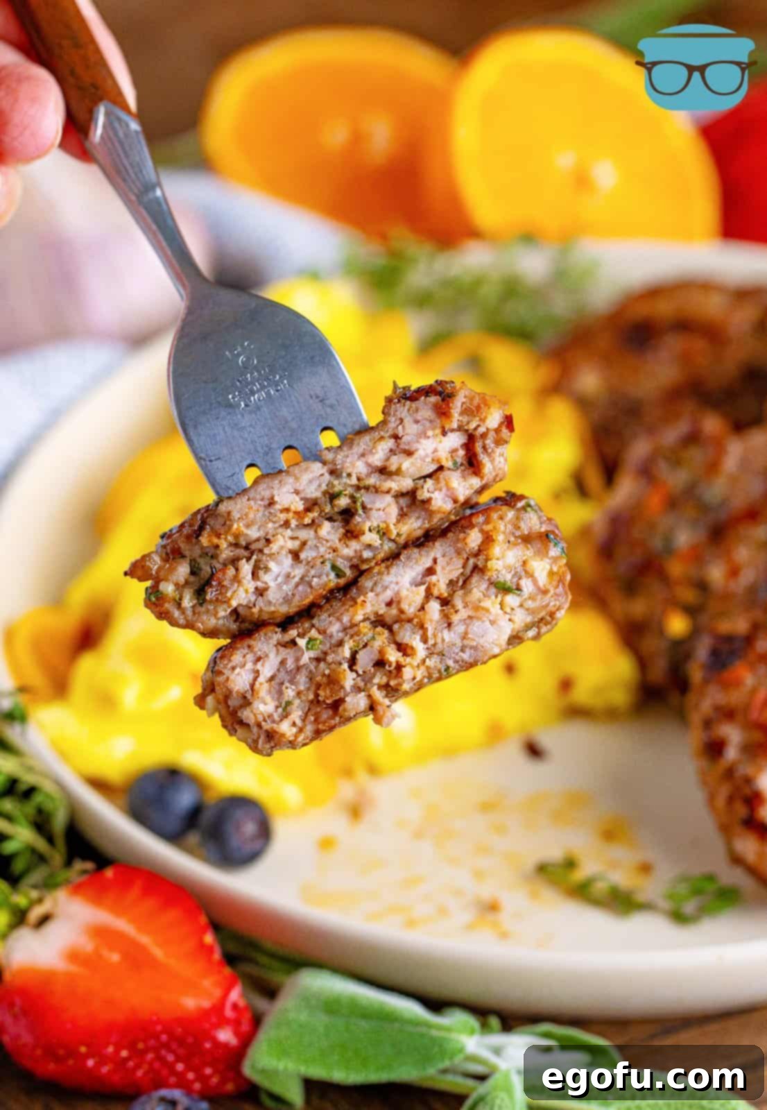 Fork holding up bites of Homemade Breakfast Sausage.