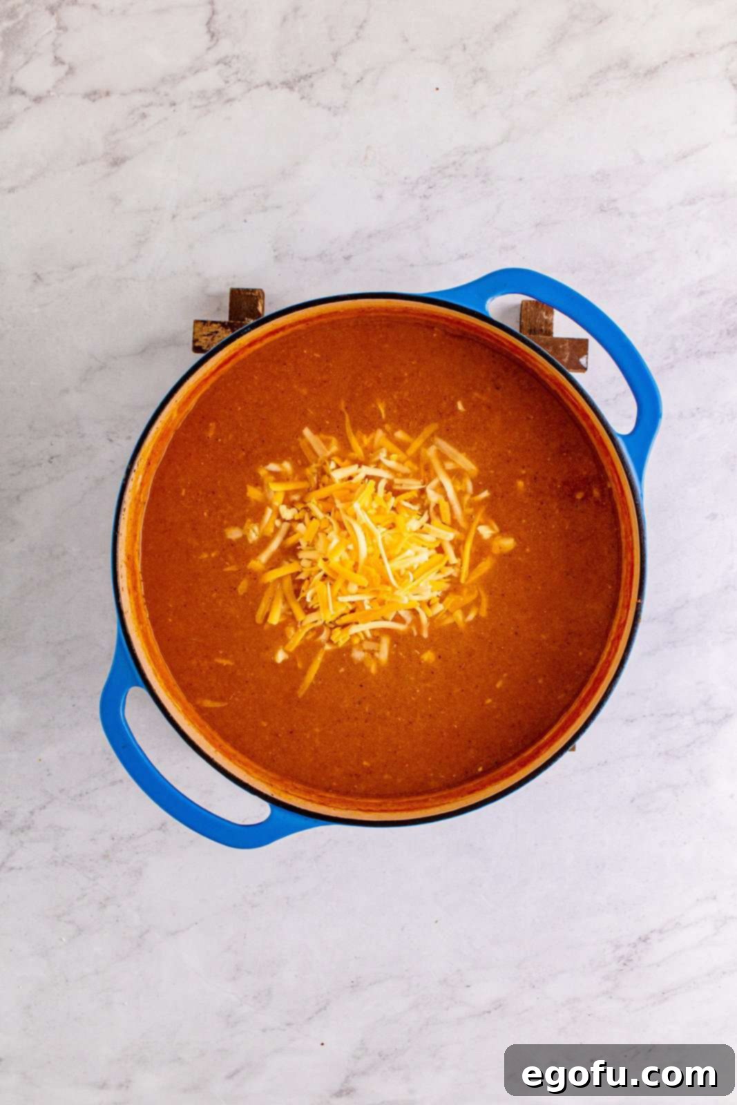 Southwest Chicken Enchilada Bowl 12 Cheese added to dutch oven.