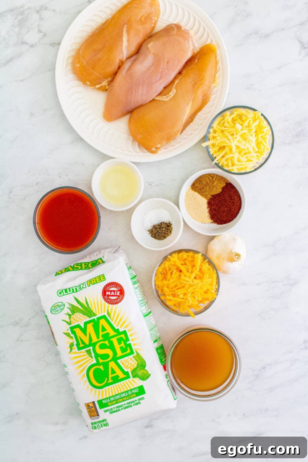 Southwest Chicken Enchilada Bowl 4 Ingredients needed: chicken breasts, kosher salt, pepper, vegetable oil, garlic, chili powder, ground cumin, onion powder, unsalted chicken stock, corn flour (masa harina), red enchilada sauce, Monterey Jack cheese and sharp cheddar cheese.